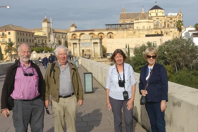 Cordoba City Tour with Mosque-Cathedral from Seville - Crossing the Roman Bridge into the old city