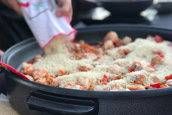 Sevilla: Rooftop Paella Cooking Class & 30-minute expert Q&A - Welcome drinks and an open-air kitchen