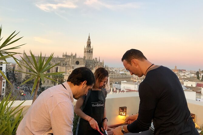 Sevilla: Rooftop Paella Cooking Class & 30-minute expert Q&A - Ask about Seville beneath the Cathedral view