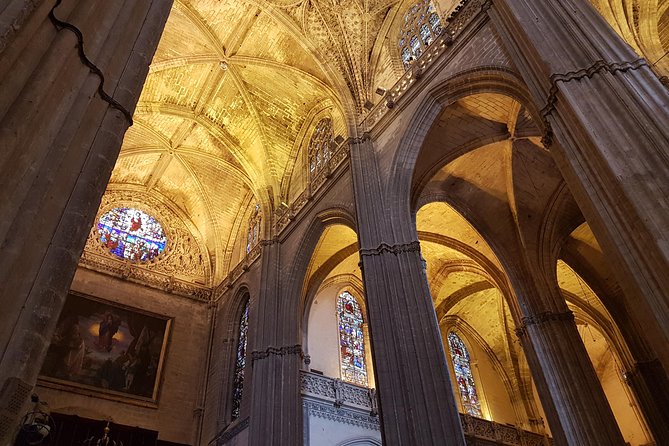 Seville Cathedral Tour including tickets and skip the line entry - Inside the cathedral: altar, paintings and scale