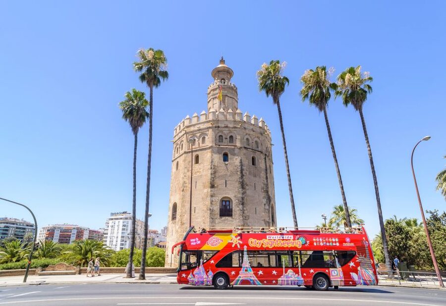 Seville: City Sightseeing Hop-On Hop-Off Bus Tour - Follow the route from the river to Plaza de España