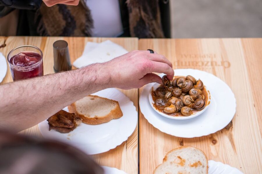 Seville: Flavors of Andalucía Guided Food Tour with Tastings - Crossing into Triana through food