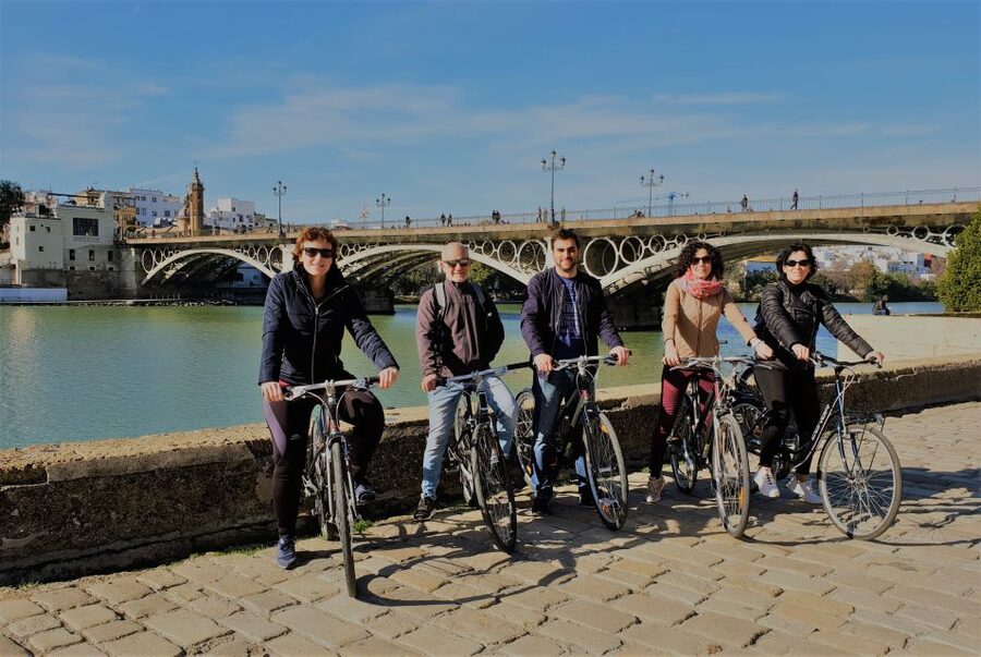 Seville: Highlights Bike Tour with Local Guide - Crossing into Triana
