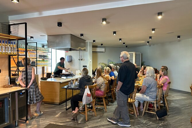Seville: Paella Showcooking Experience - Starting With Wine, Olives and Andalusian Snacks
