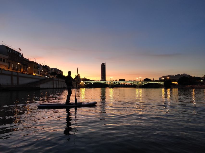 Seville: Sunset and Evening Paddle Boarding Tour - Passing Puente de Isabel II and Triana Bridge